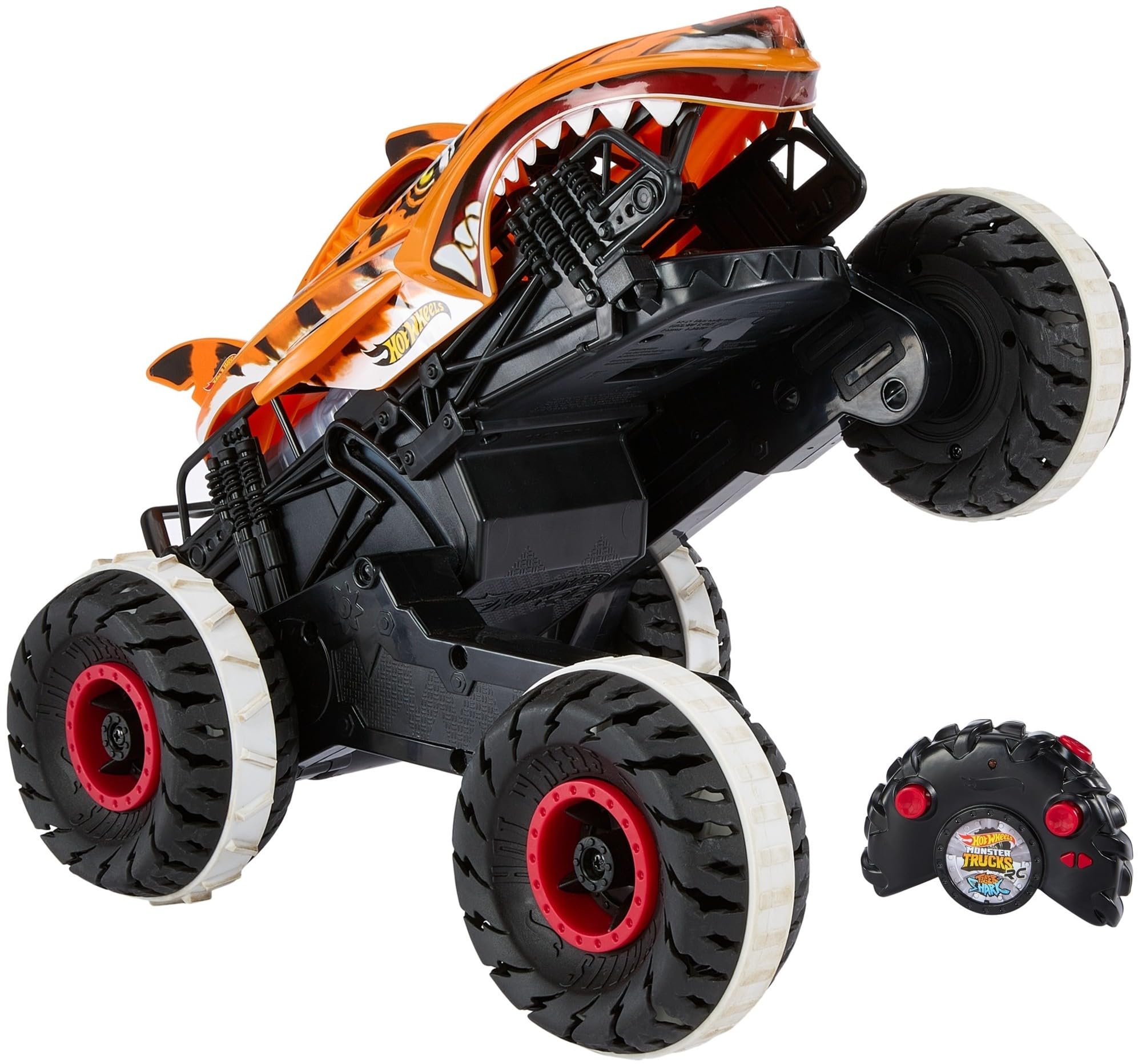 خرید از آمازون - ماشین کنترل از راه دور Hot Wheels Tiger Shark، کامیون هیولا، با فناوری «Terrain Stomp» برای حرکات حیوانات مانند، حالت چرخ برای چرخاندن 2 چرخ، اسباب بازی از 4 سال، HGV87 Tiger Shark Single